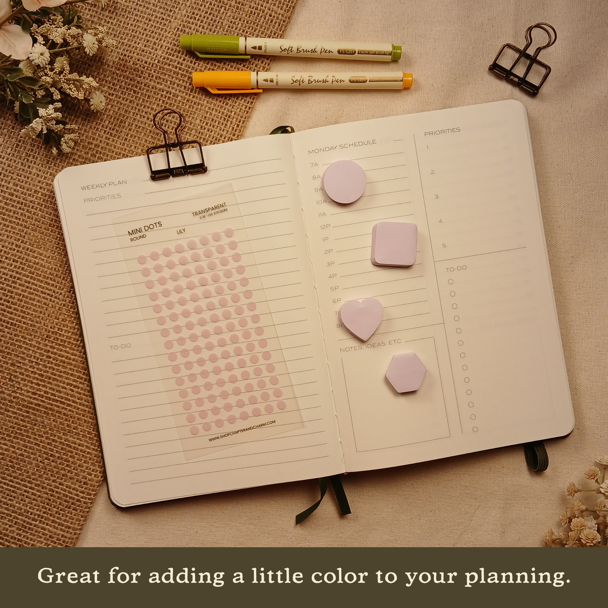 Lily light purple transparent matte round planner dot stickers displayed with coordinating sticky notes on an open planner. The image includes the text, 