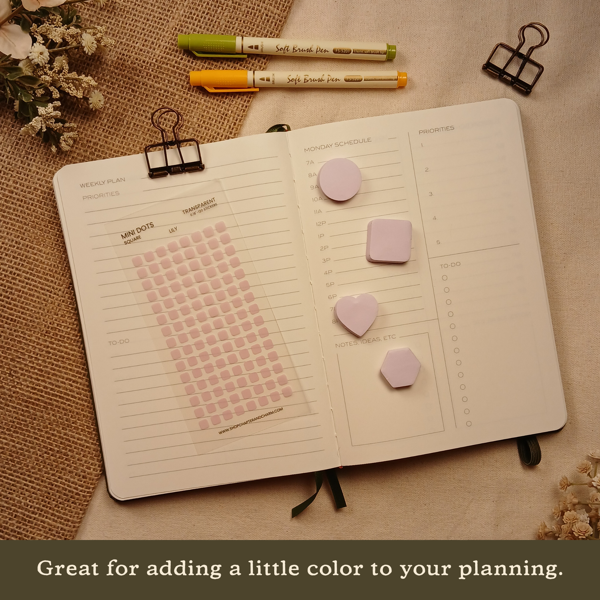 Lily light purple transparent matte square planner stickers displayed with coordinating sticky notes on an open planner. The image includes the text, 