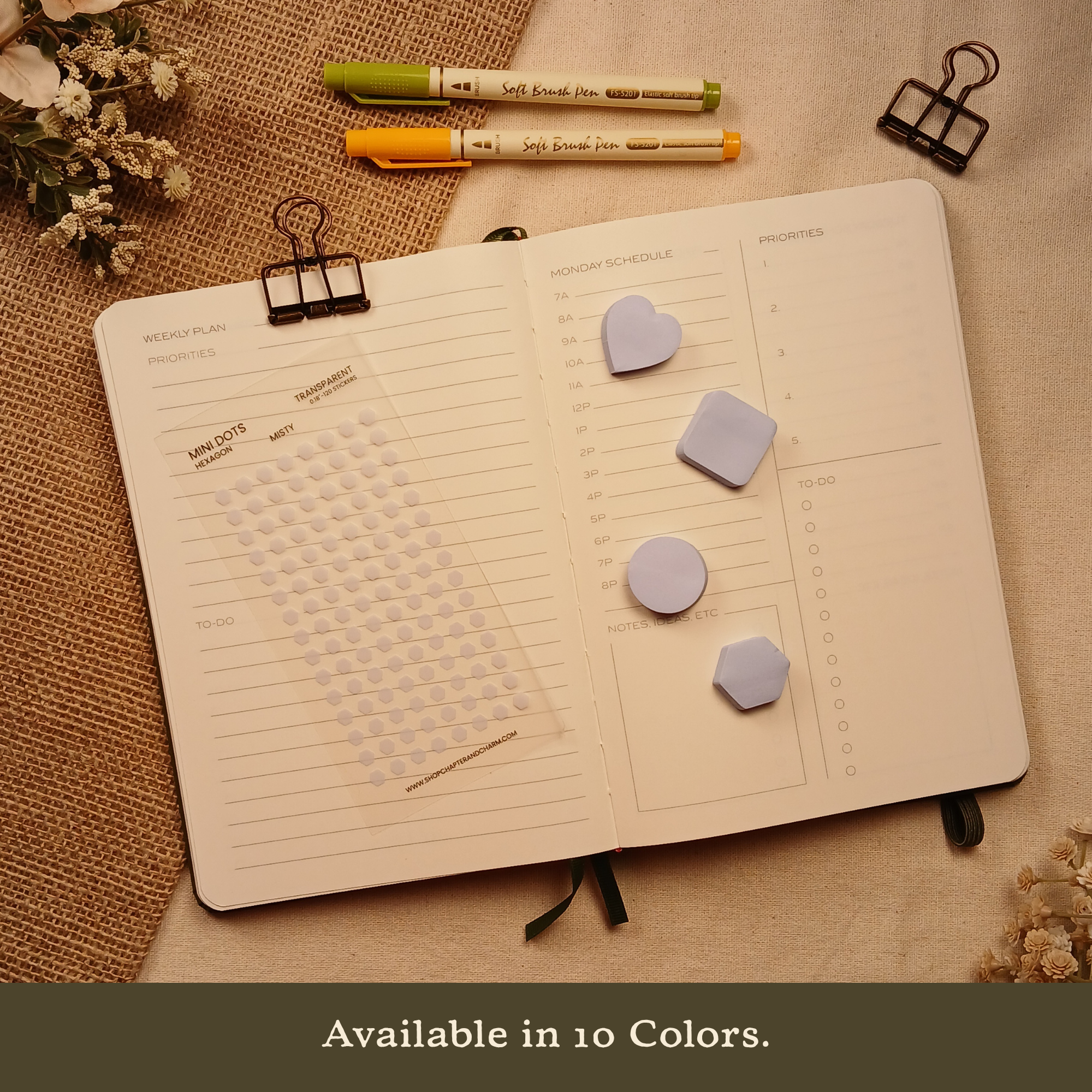 Misty white transparent hexagon planner sticker sheet displayed with coordinating sticky notes in four matching shapes on an open planner. Banner text reads: 