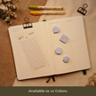 Misty light gray transparent matte square planner stickers displayed with coordinating sticky notes on an open planner. The image includes the text, 