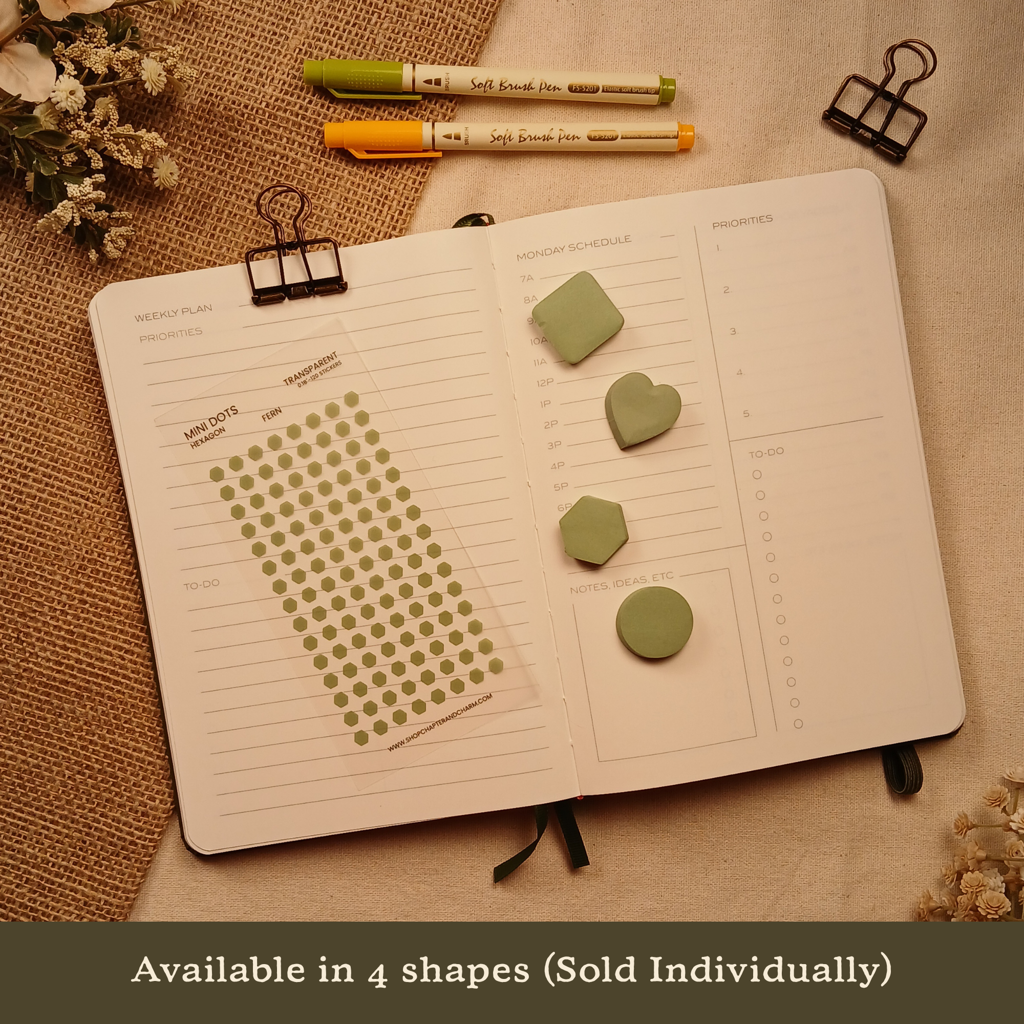Fern green transparent hexagon planner sticker sheet displayed with matching heart, circle, rounded square, and hexagon sticky notes on an open planner. Banner text reads: 