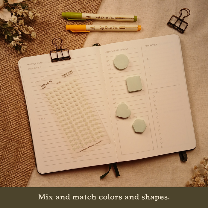 Sage green transparent heart planner sticker sheet with matching sticky notes arranged on an open planner. Text reads: 
