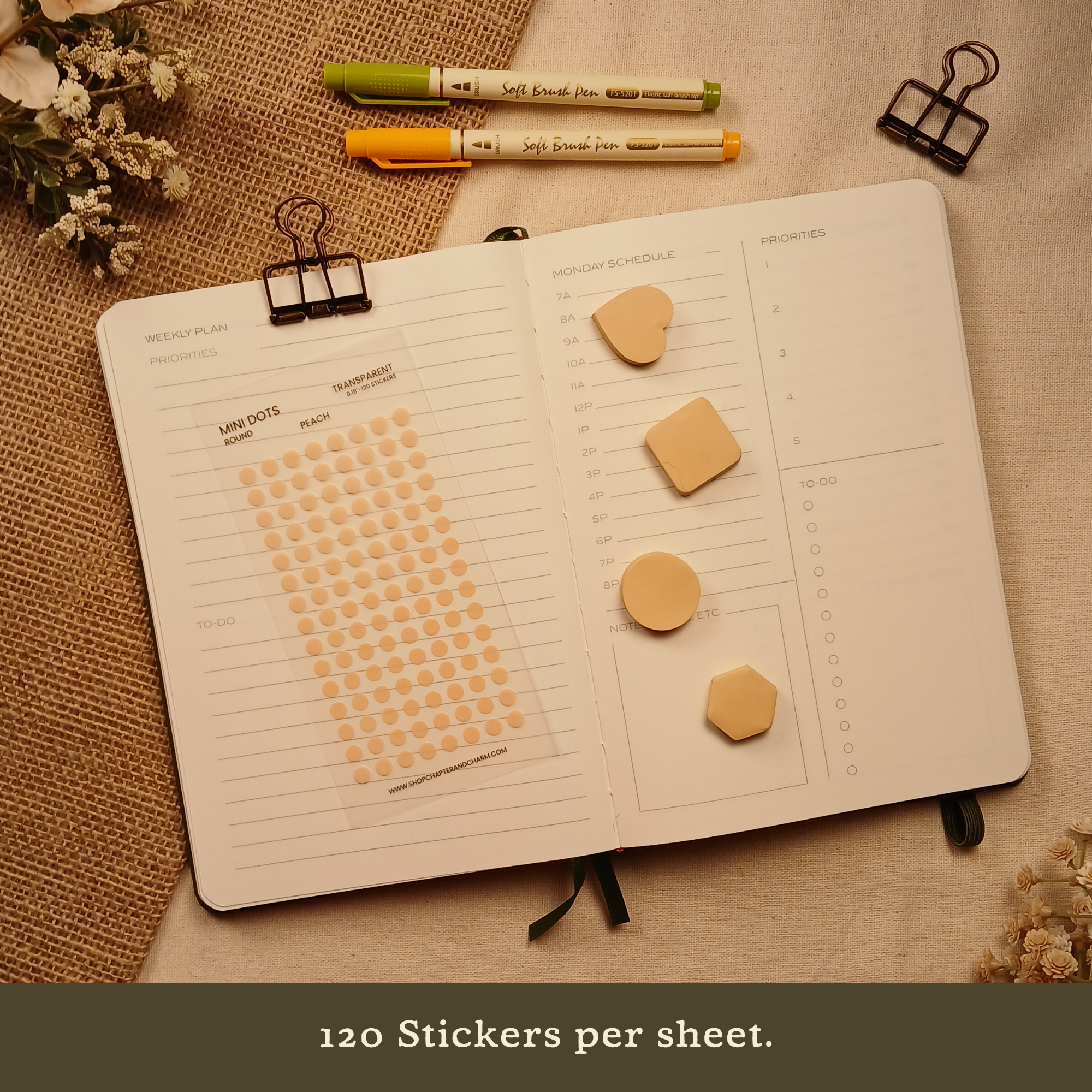 Peach transparent matte round planner dot stickers displayed with coordinating sticky notes on an open planner. The image includes the text, 