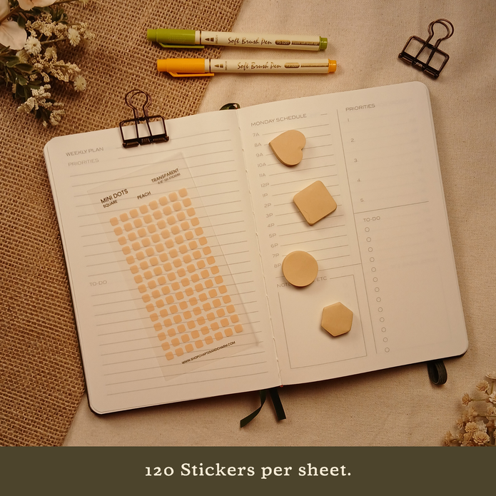 Peach transparent matte square planner stickers displayed with coordinating sticky notes on an open planner. The image includes the text, 
