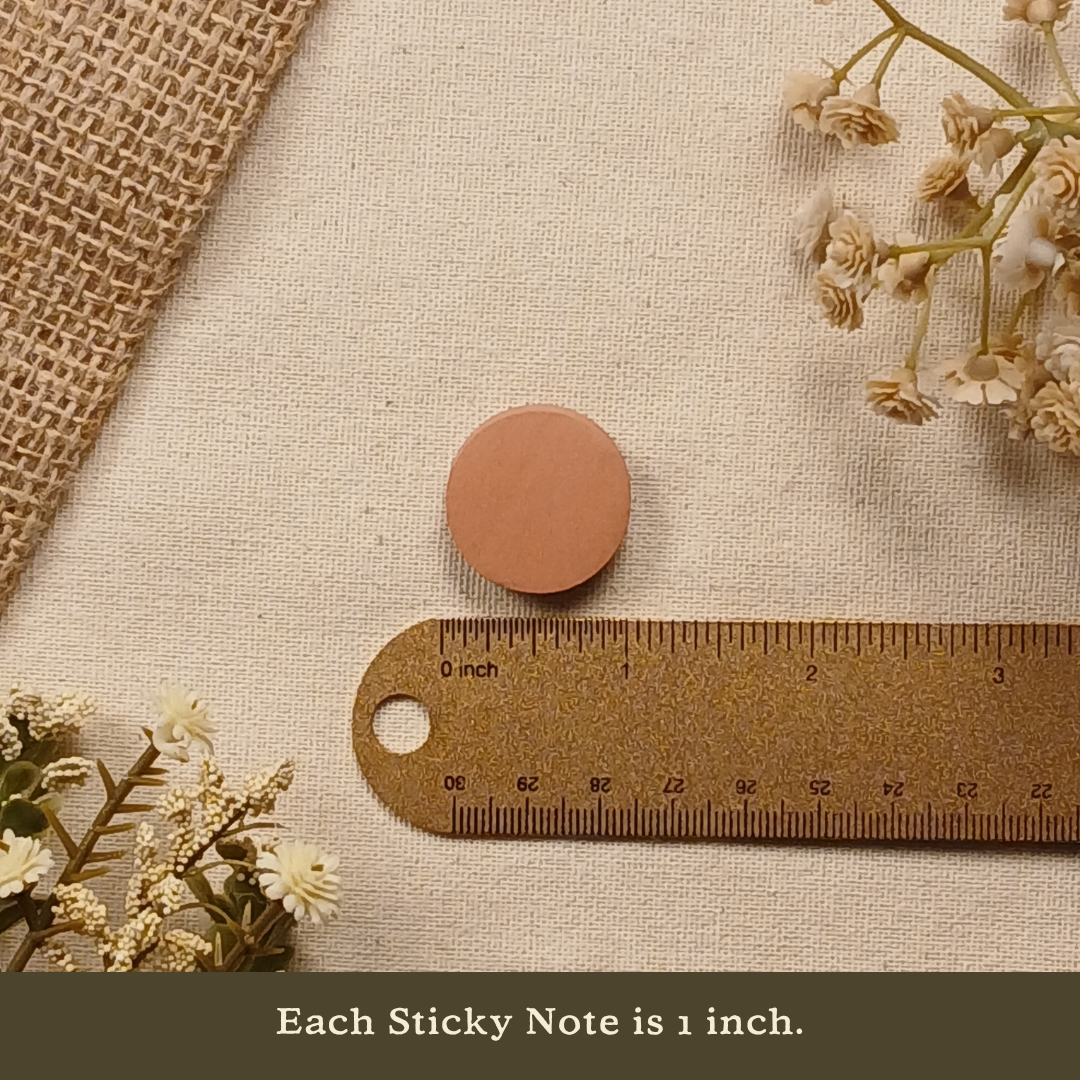 One-inch round sticky note displayed next to a ruler on a neutral linen background with the text 